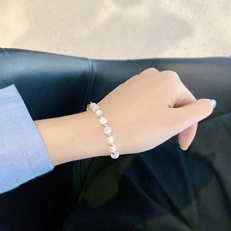 Golden Bracelets With Shiny White Beads