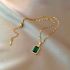 Golden Necklace With Green Stone