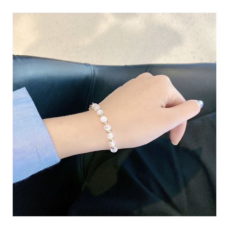 Golden Bracelets With Shiny White Beads