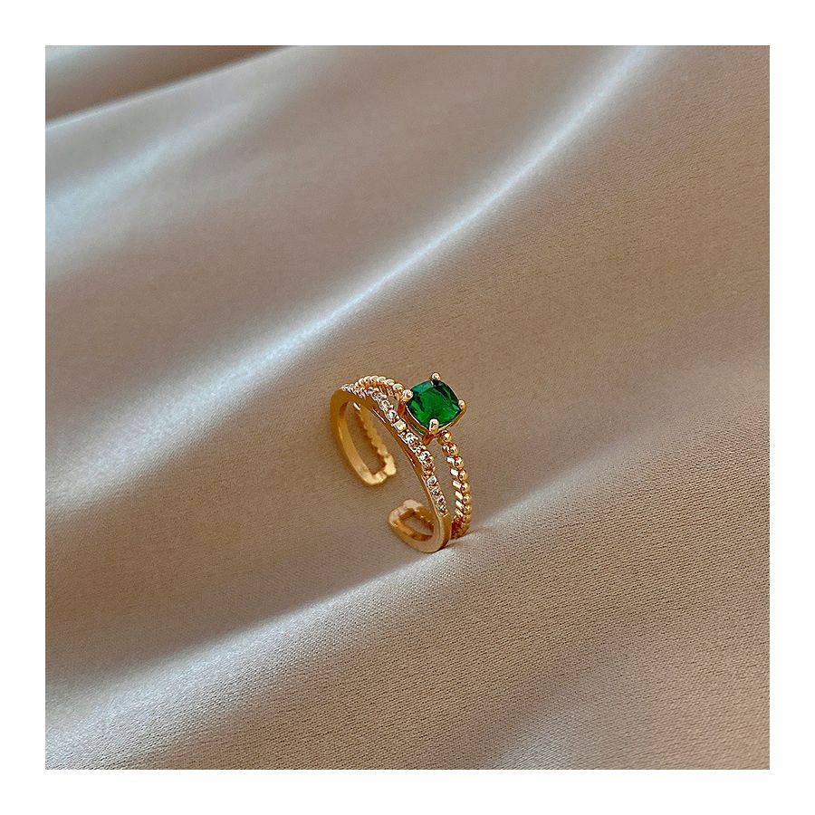 Koninklijke gouden verstelbare ring met groene steen