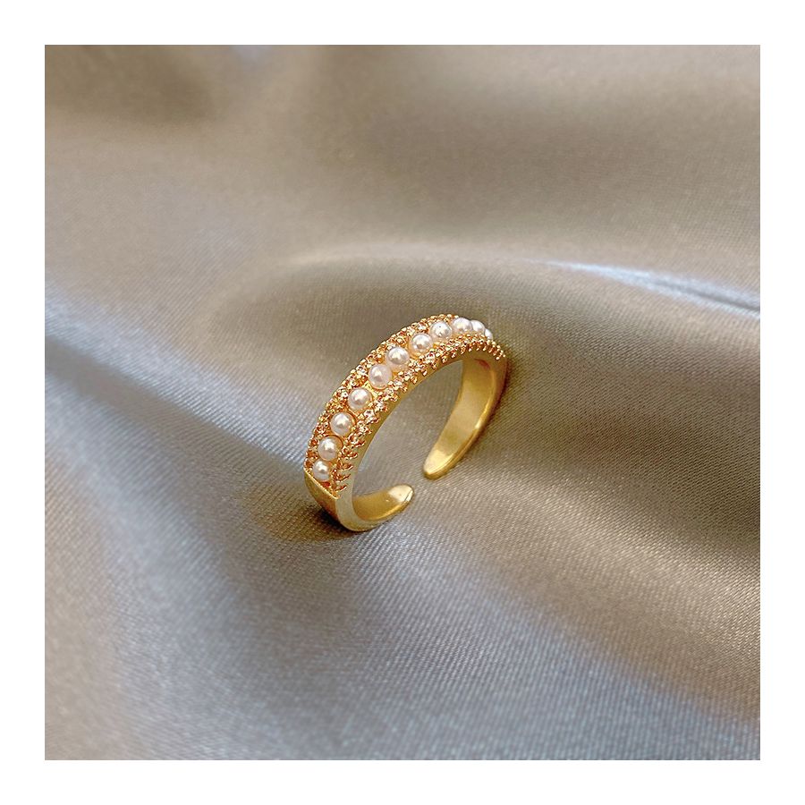 Verstelbare gouden ring met parelpatroon