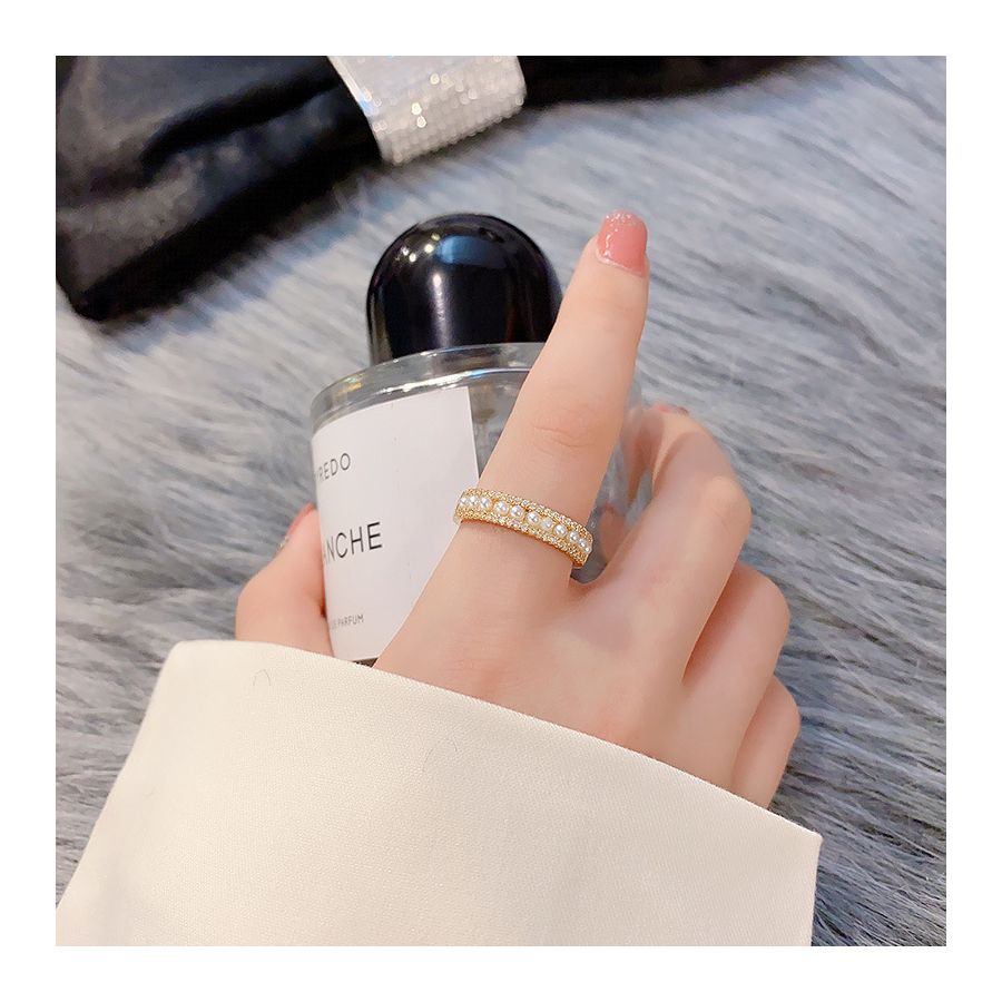 Verstelbare gouden ring met parelpatroon