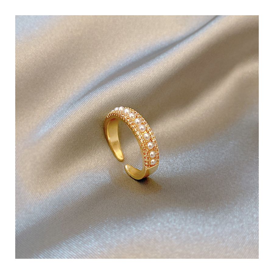 Verstelbare gouden ring met parelpatroon