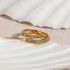 Gouden gedraaide lus met verstelbare ring met zirkonen