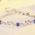 Stylish Silver Bracelet With Purple Zircons & Loop Pattern